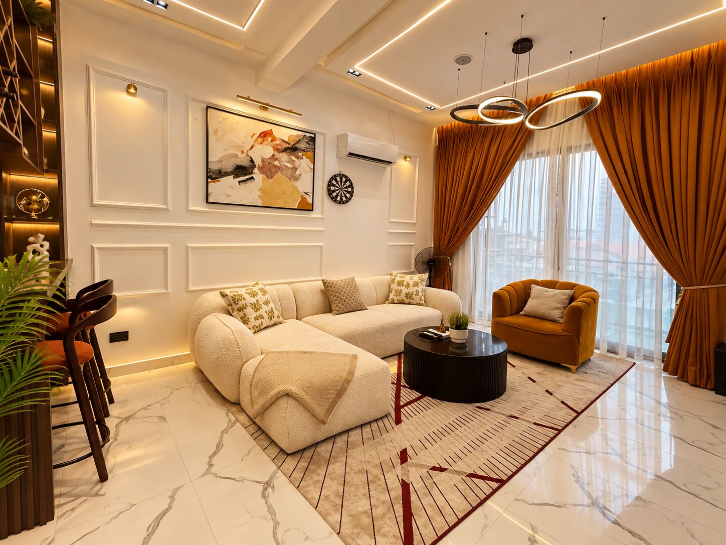 Light-filled living room with curved sofa and copper drapes
