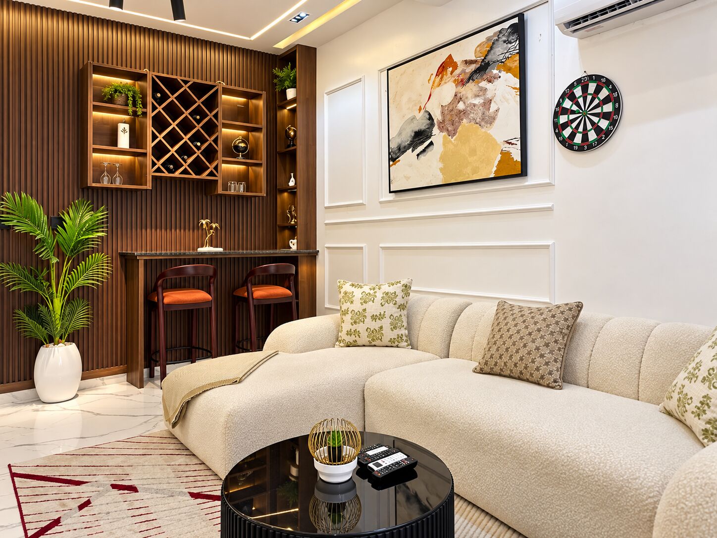 Apartment living room with curved sofa, bar seating and artwork