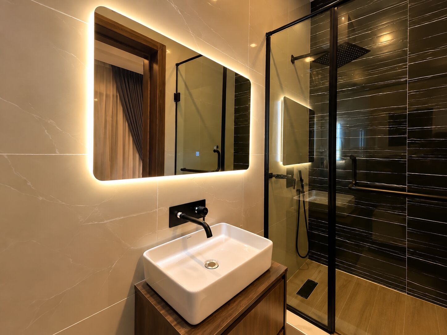 Bathroom with backlit mirror, stone basin and rain shower