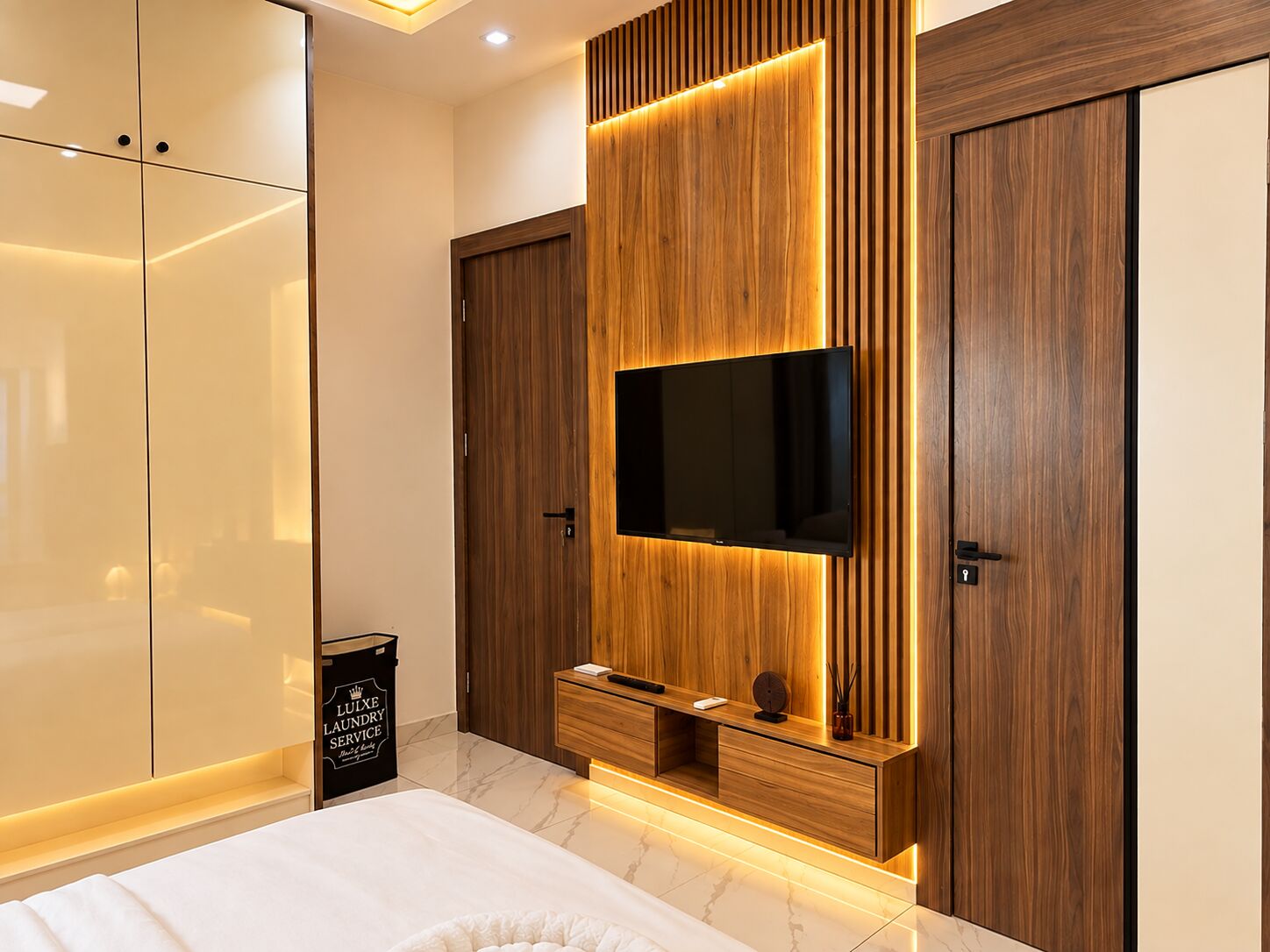 Executive Suite with fluted timber feature wall and wall-mounted TV