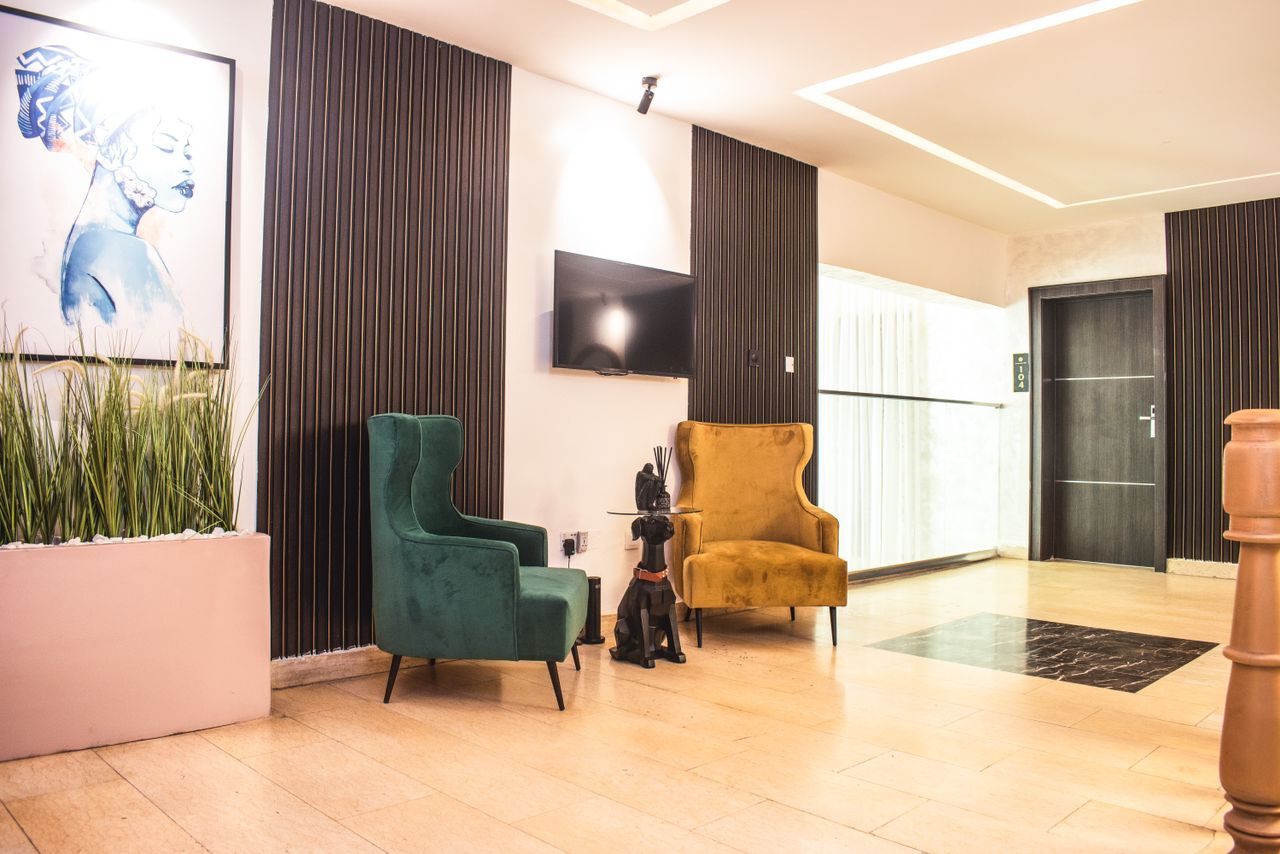 The Limewood lobby lounge with velvet armchairs and timber panelling
