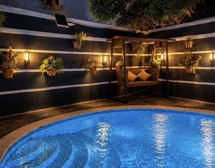 Poolside cabana with cushions and lanterns